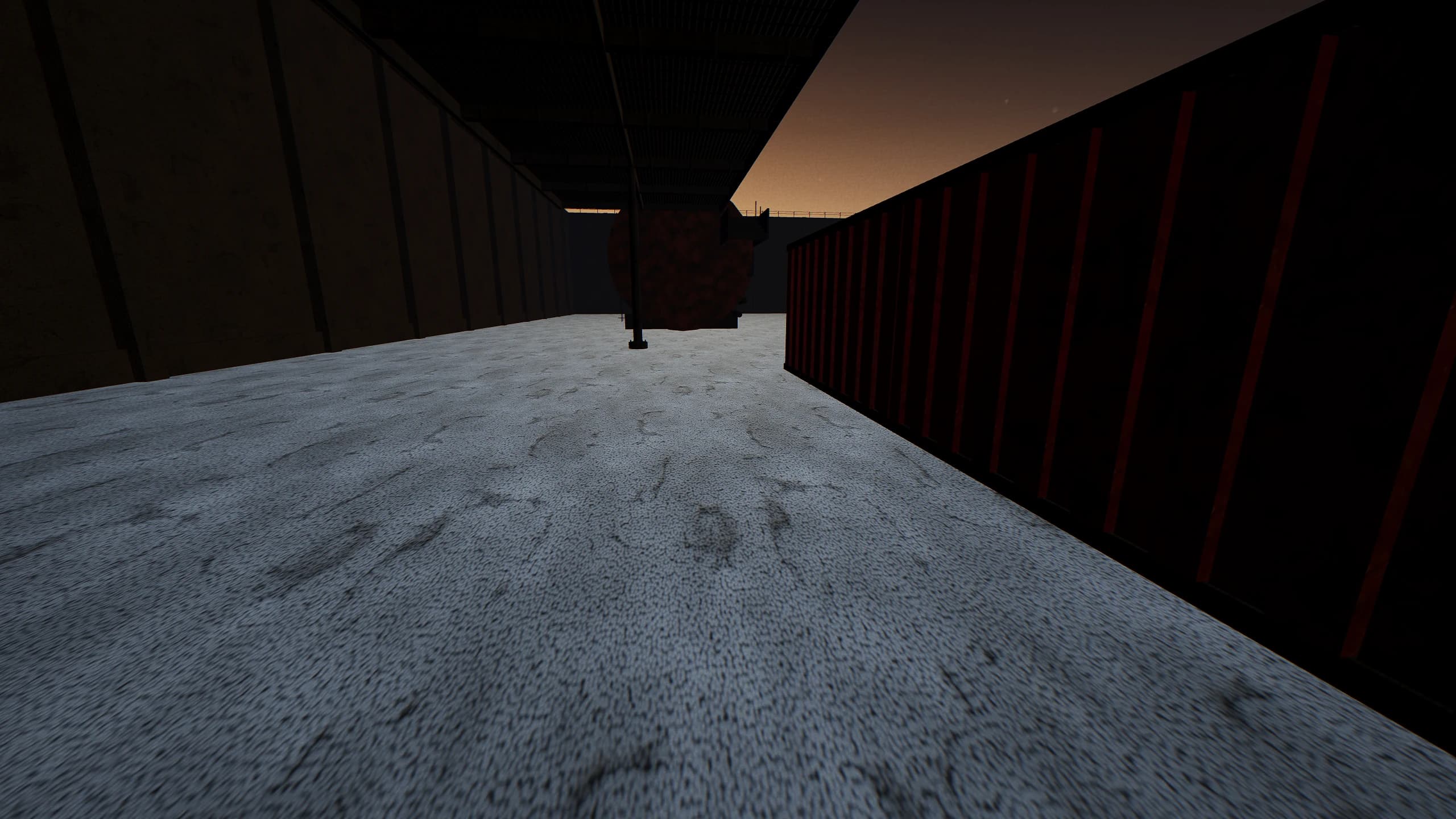 Beneath the east gantry, looking up the tank row. Holding the deck overhead means giving up the lane below it.